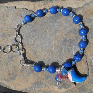 Handmade bracelet with three-dimensional enamelled silver shoe charm & 8mm beads